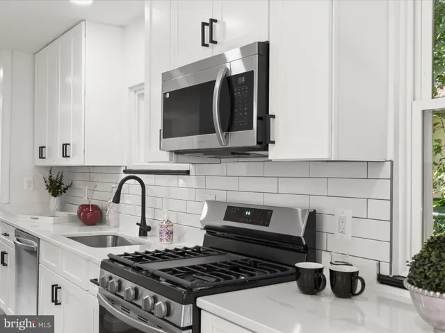 a bedroom with a bed and a mirror