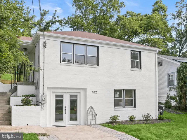 a view of a park with large trees