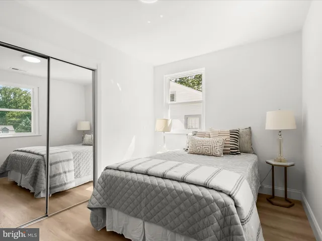 a bedroom with a large bed and a view of bedroom