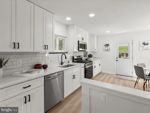 a bedroom with a bed and a night stand