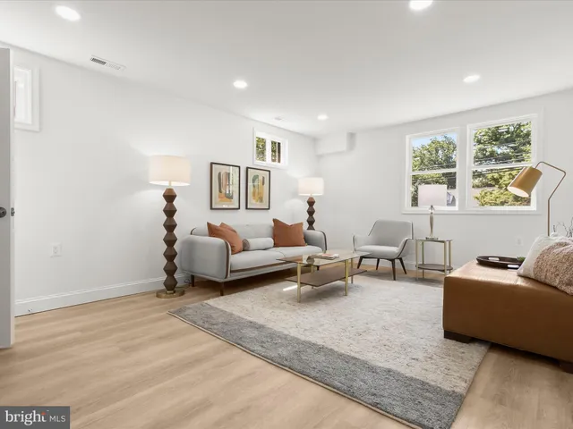 a bathroom with a sink mirror vanity and toilet