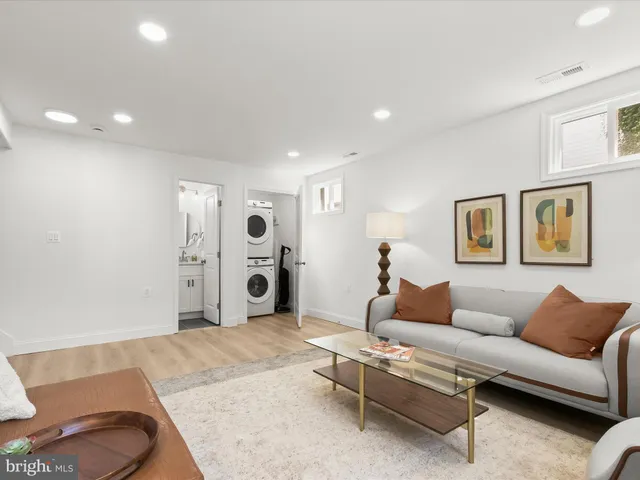 a utility room with sink dryer and washer