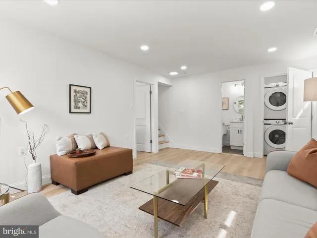 a view of a patio with lawn chairs floor to ceiling window and yard