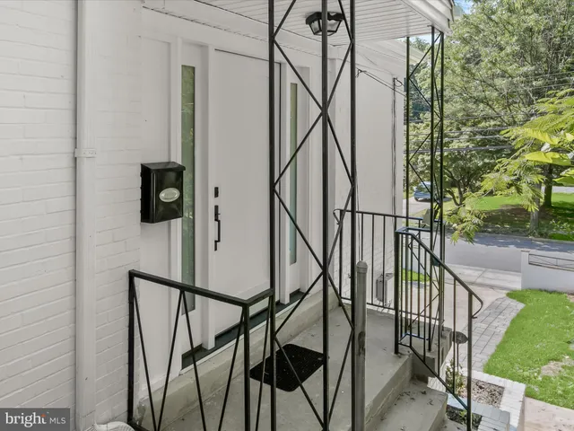 a view of kitchen with furniture and wooden floor
