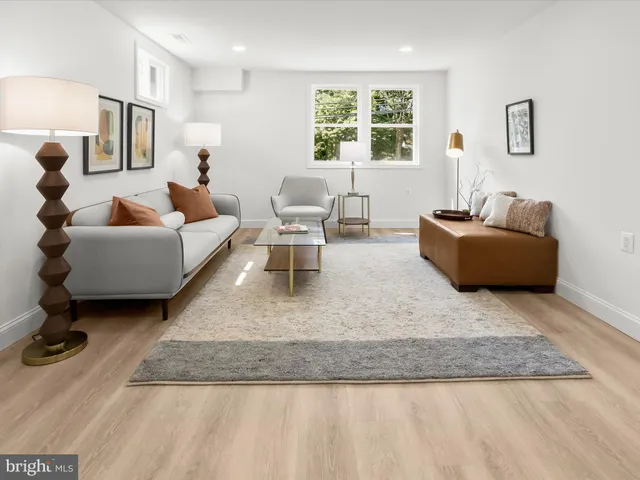 a view of a house and patio with couches chairs and a yard