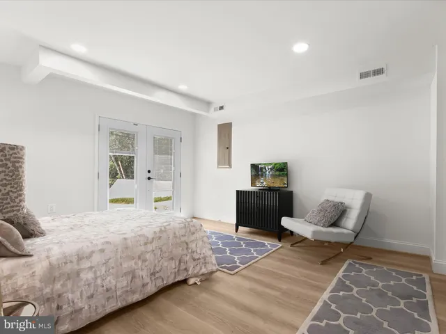 a front view of a house with a yard table and chairs