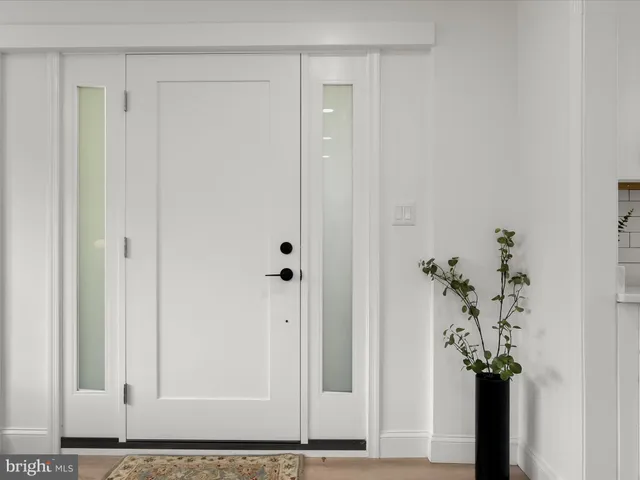 a living room with furniture a window and a rug