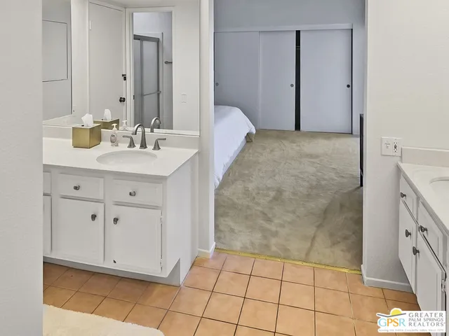 a bathroom with a sink a vanity and a mirror