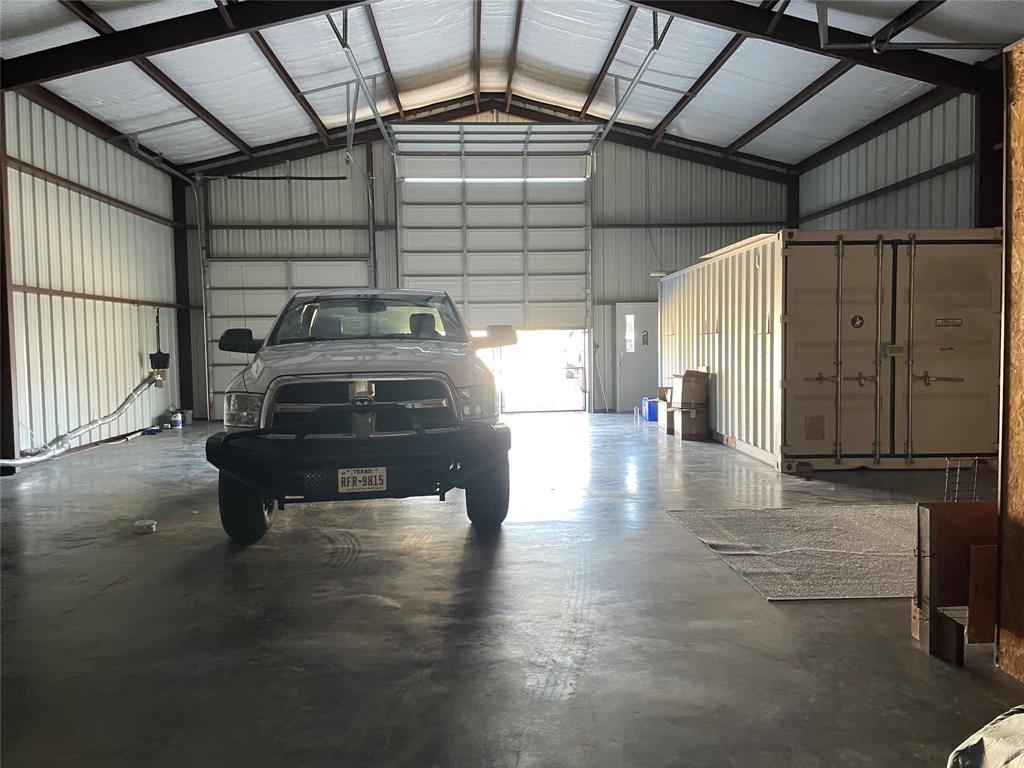 247 Comanche Quitman, TX 75783 - Photo 11 of 12 a view of a garage with wooden floor