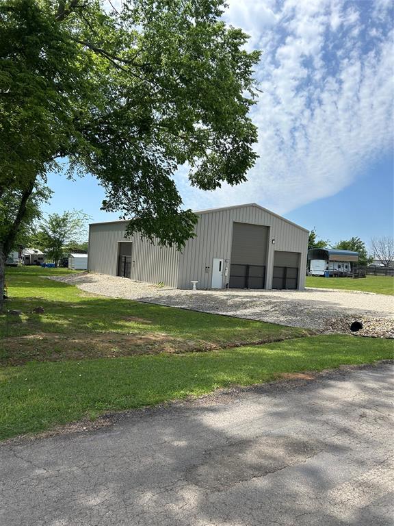 247 Comanche Quitman, TX 75783 - Photo 2 of 12 a front view of house with yard and green space