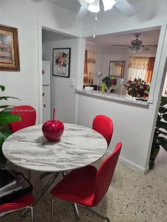 a view of a dining room with furniture