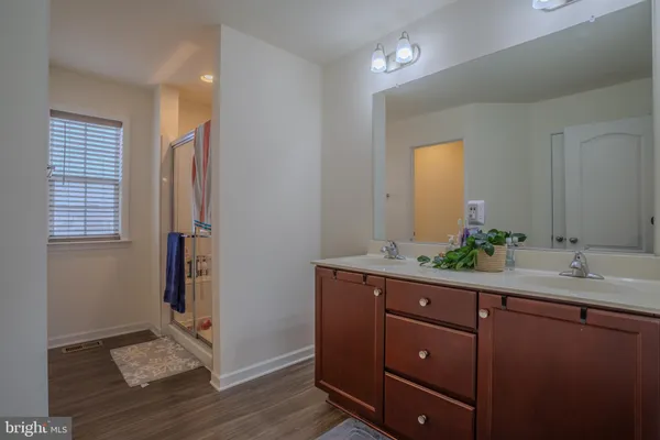 a room with a sink and a mirror