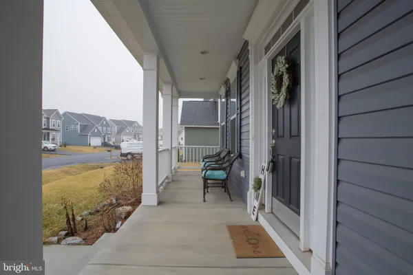 a view of a balcony with furniture and a shower