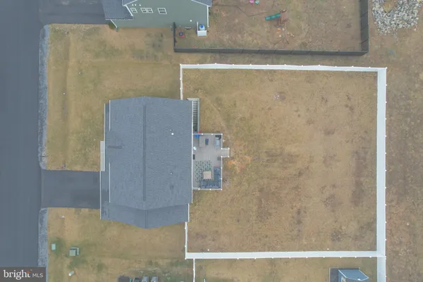 an aerial view of residential houses with city view