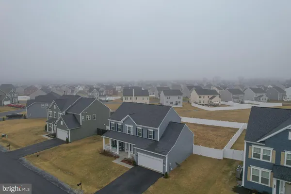 a front view of a house with yard
