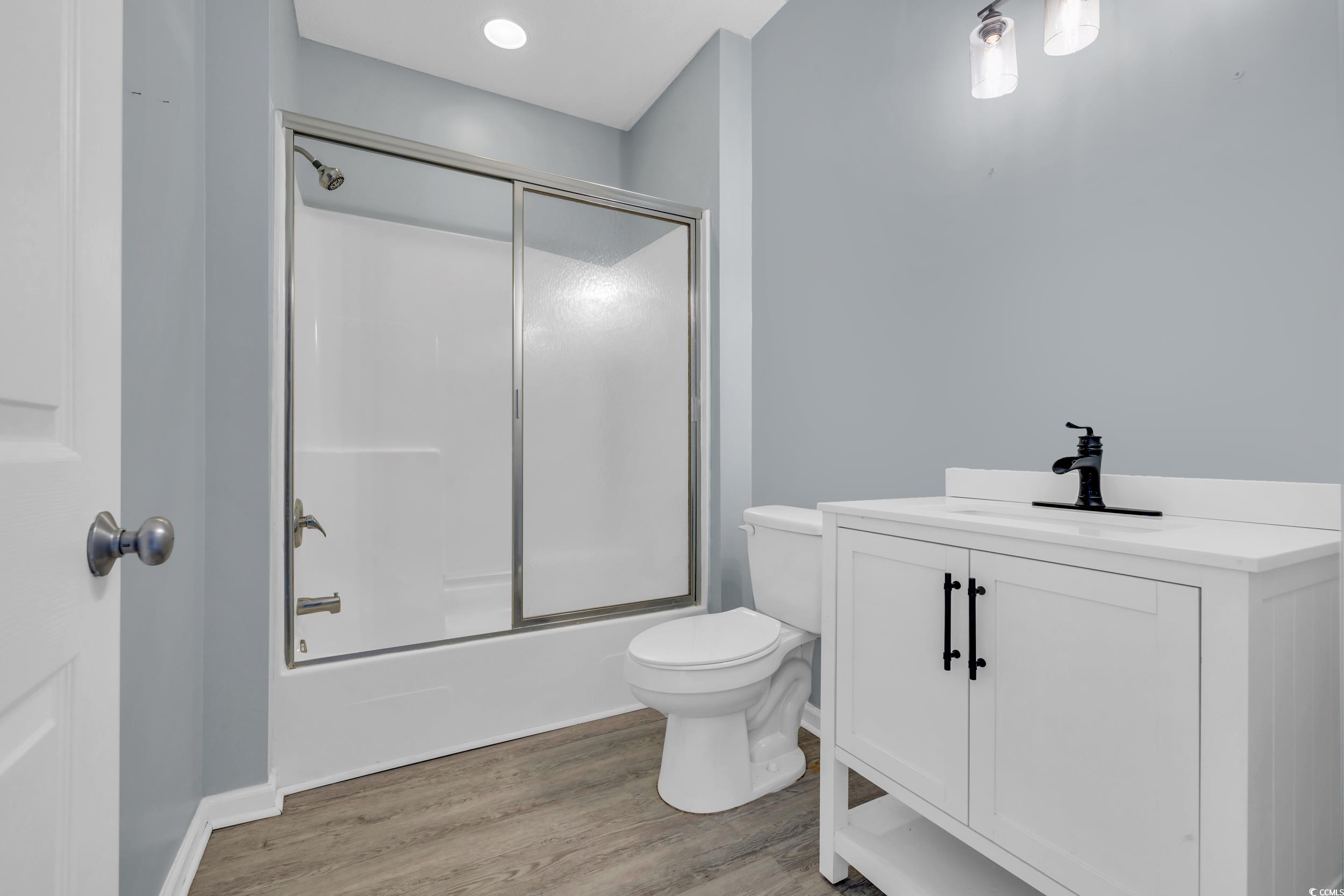 4545 Girvan Drive, Unit E Myrtle Beach, SC 29579 - Photo 15 of 27 Full bathroom with hardwood / wood-style floors, v