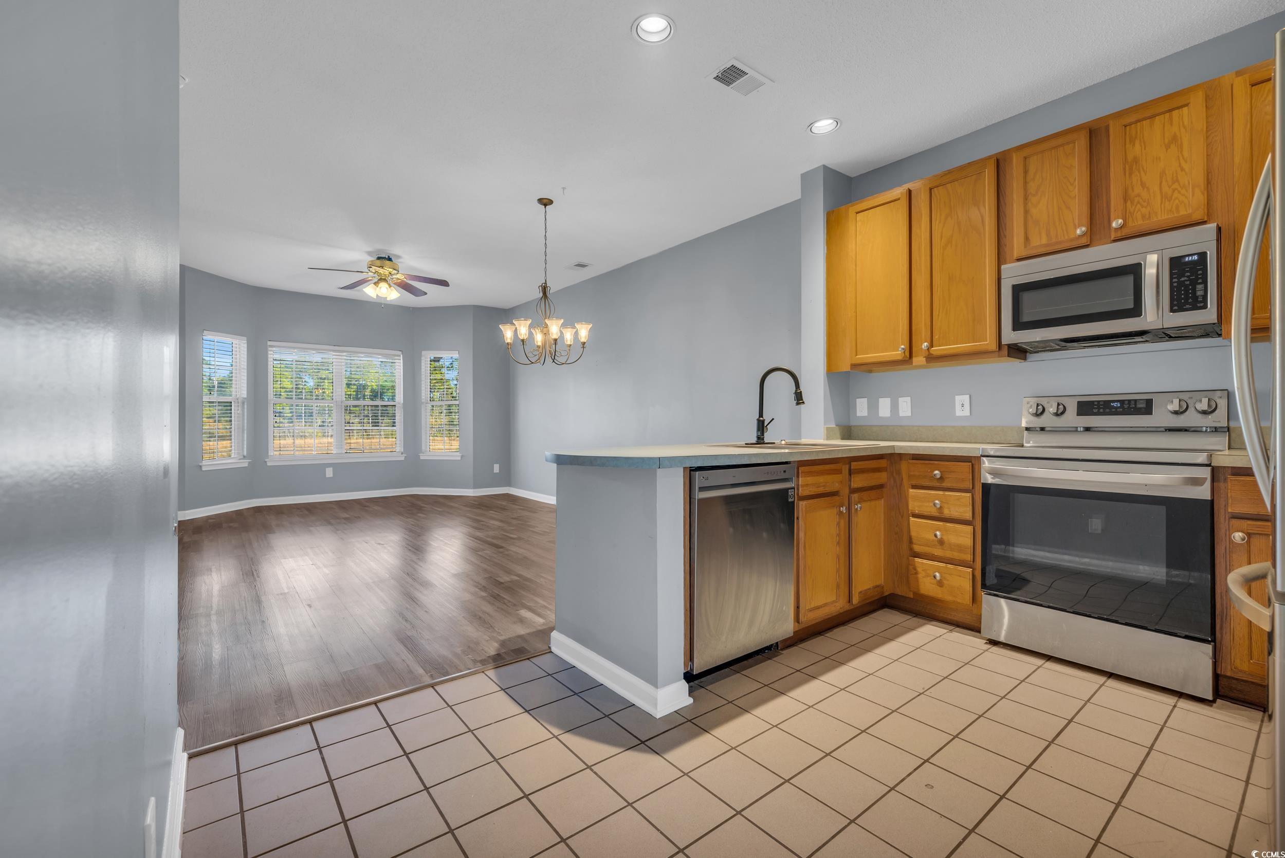 4545 Girvan Drive, Unit E Myrtle Beach, SC 29579 - Photo 5 of 27 Kitchen with appliances with stainless steel finis