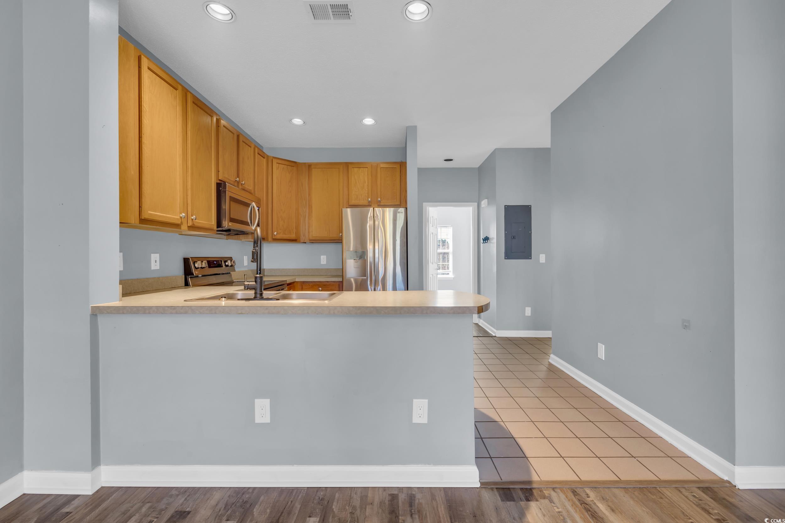 4545 Girvan Drive, Unit E Myrtle Beach, SC 29579 - Photo 7 of 27 Kitchen with sink, stainless steel appliances, kit