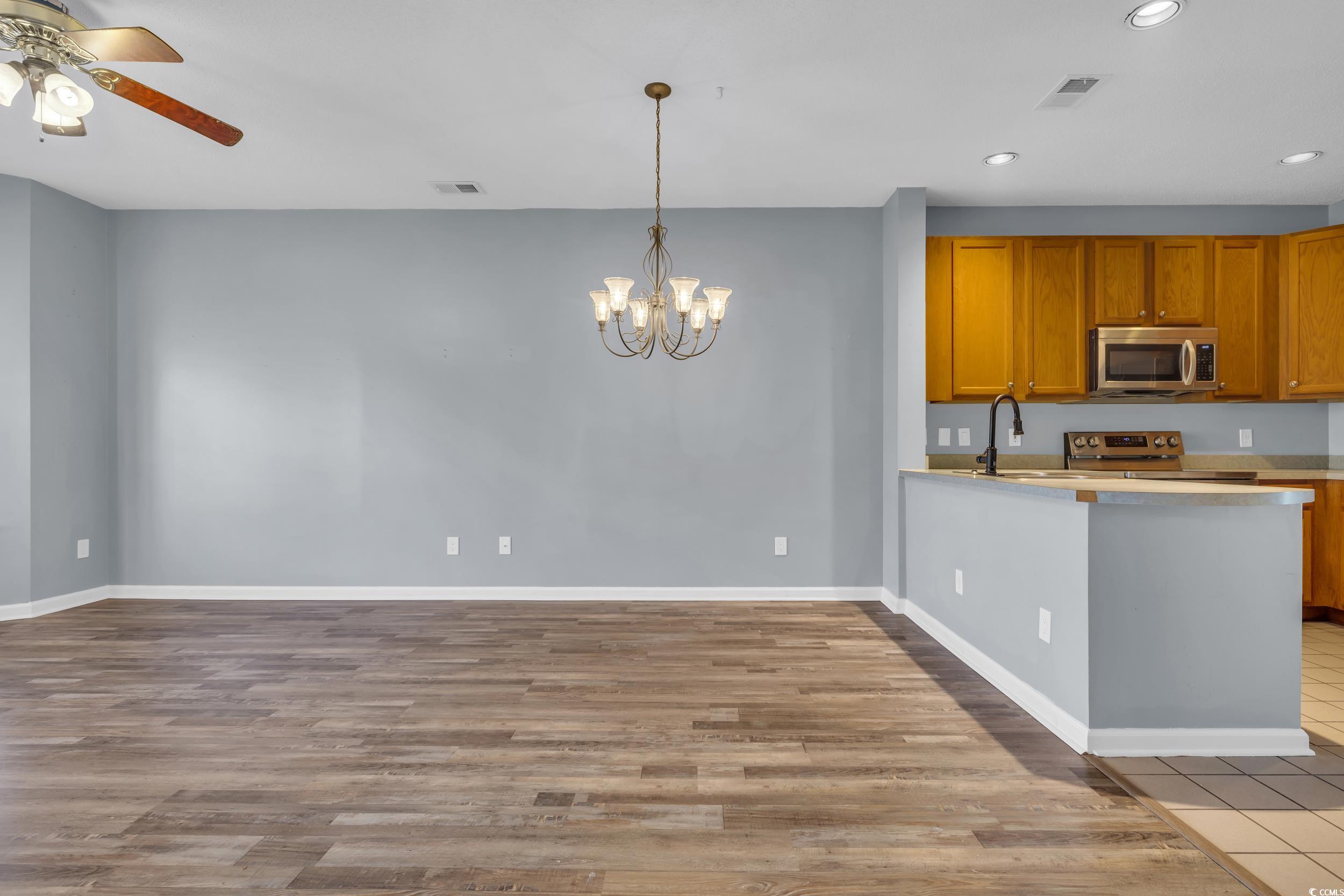 4545 Girvan Drive, Unit E Myrtle Beach, SC 29579 - Photo 8 of 27 Kitchen featuring sink, light hardwood / wood-styl