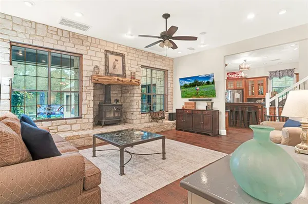 a living room with furniture and a floor to ceiling window