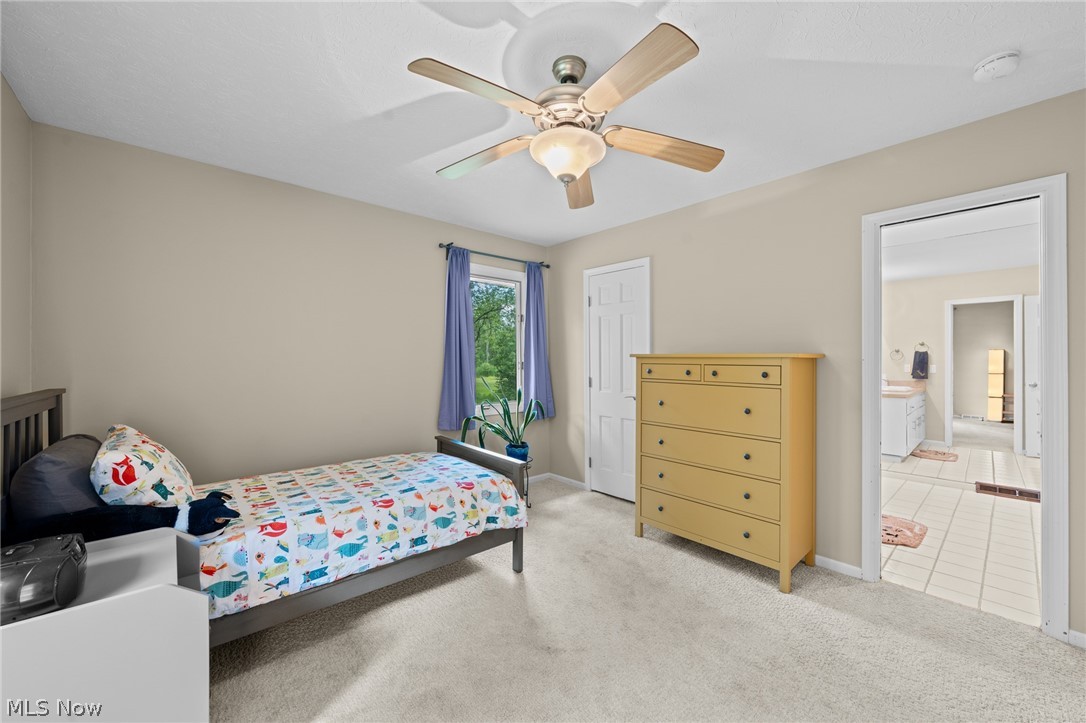 4830 Som Center Road Moreland Hills, OH 44022 - Photo 27 of 48 A bright and inviting second bedroom: comfortable, versatile, and ready to welcome family, guests, or whatever the next chapter brings.