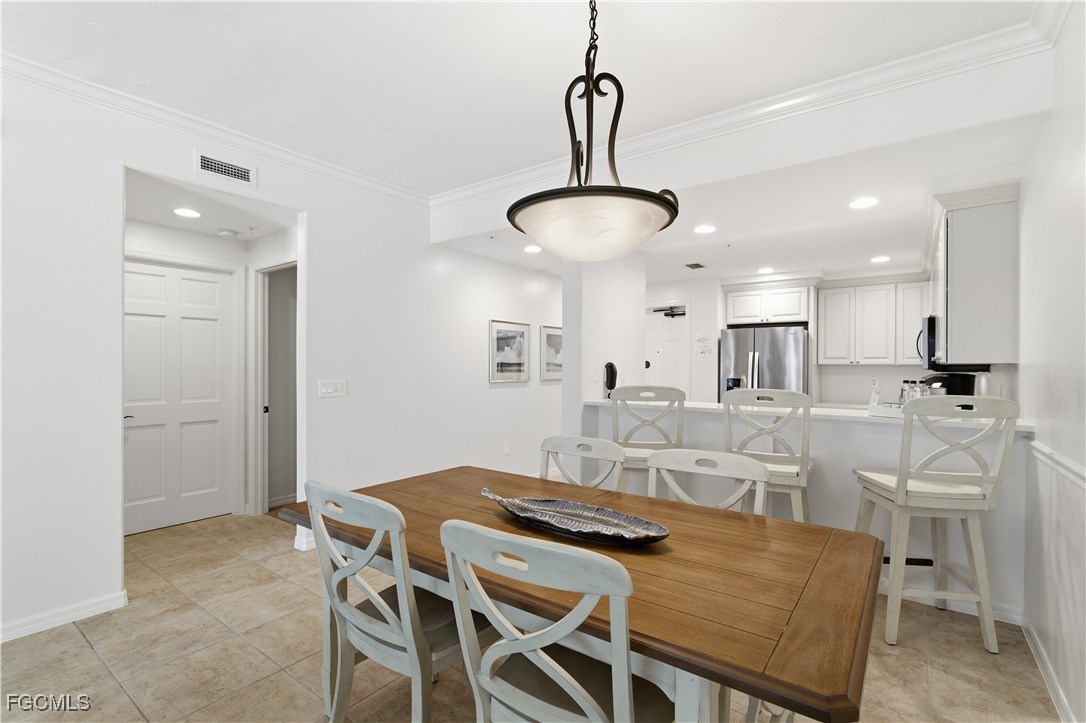 221 9th Street South, Unit 207 Naples, FL 34102 - Photo 12 of 38 a view of a dining room and livingroom view