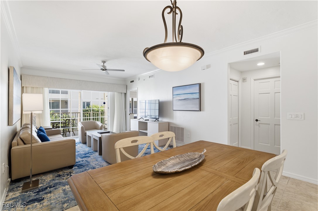 221 9th Street South, Unit 207 Naples, FL 34102 - Photo 13 of 38 a bedroom with furniture and a large window