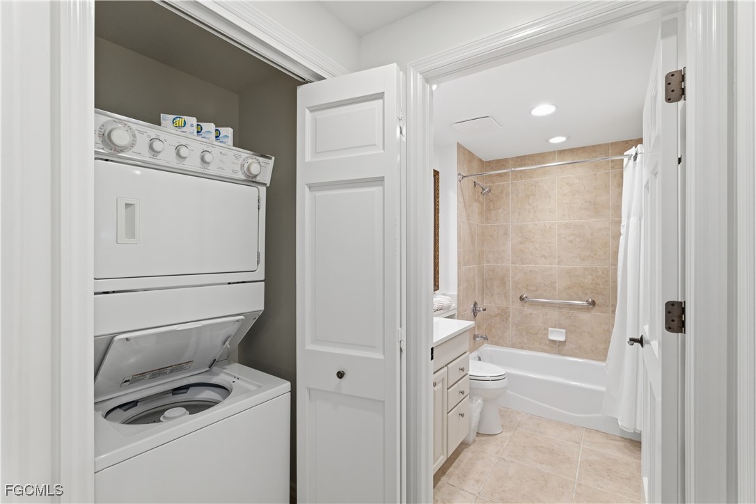 221 9th Street South, Unit 207 Naples, FL 34102 - Photo 28 of 38 a bathroom with a toilet a sink and a shower
