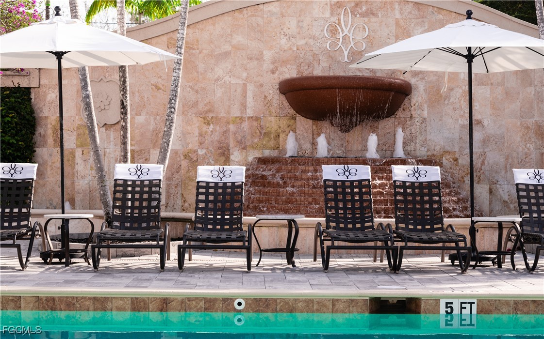 221 9th Street South, Unit 207 Naples, FL 34102 - Photo 30 of 38 a view of outdoor space with seating