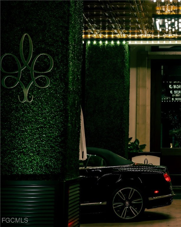 221 9th Street South, Unit 207 Naples, FL 34102 - Photo 32 of 38 a car parked in front of a house