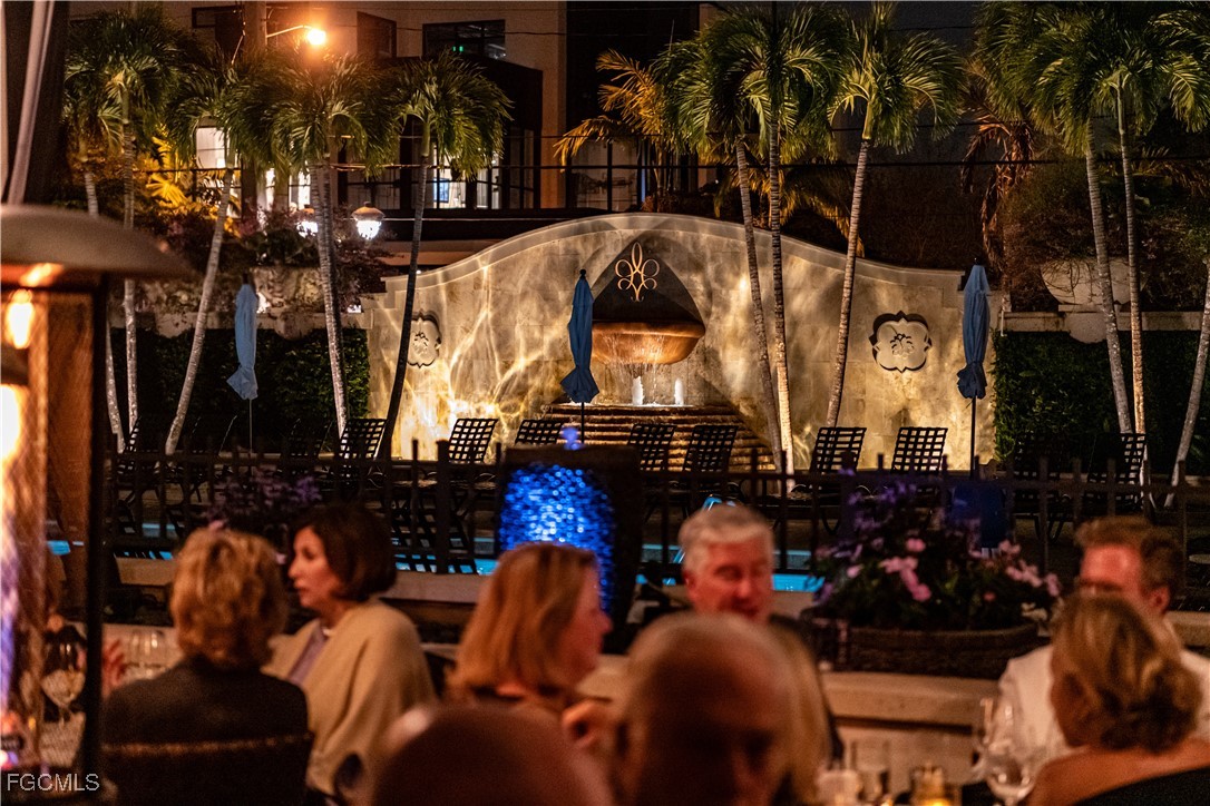 221 9th Street South, Unit 207 Naples, FL 34102 - Photo 33 of 38 a room with lots of different colored cloths