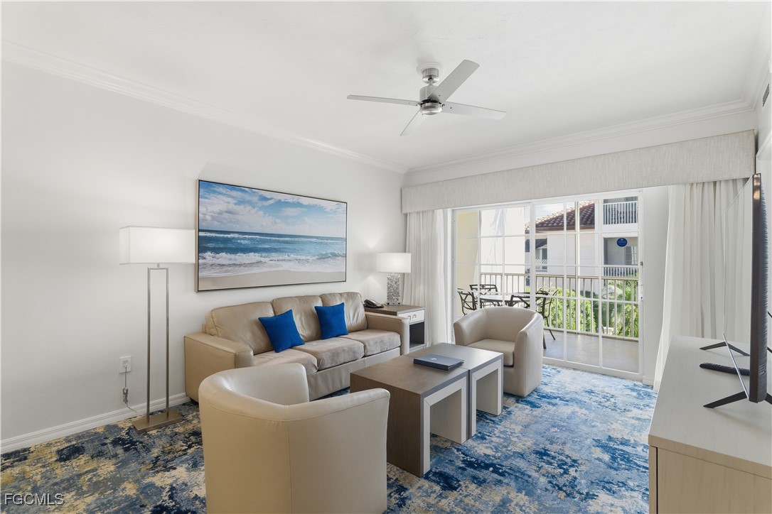 221 9th Street South, Unit 207 Naples, FL 34102 - Photo 6 of 38 a living room with furniture and a large window