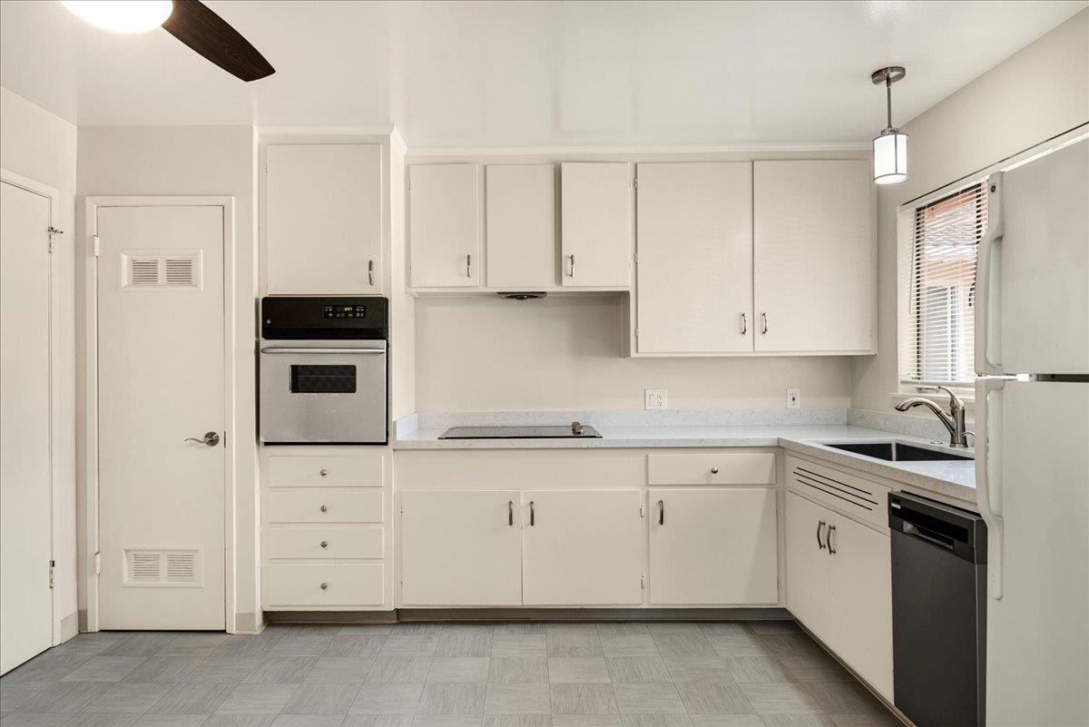 1198 Boranda Avenue Mountain View, CA 94040 - Photo 11 of 38 a kitchen with granite countertop white cabinets and white appliances