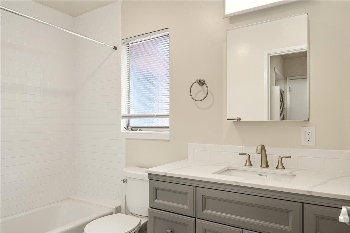 1198 Boranda Avenue Mountain View, CA 94040 - Photo 16 of 38 a bathroom with a granite countertop sink mirror vanity and toilet
