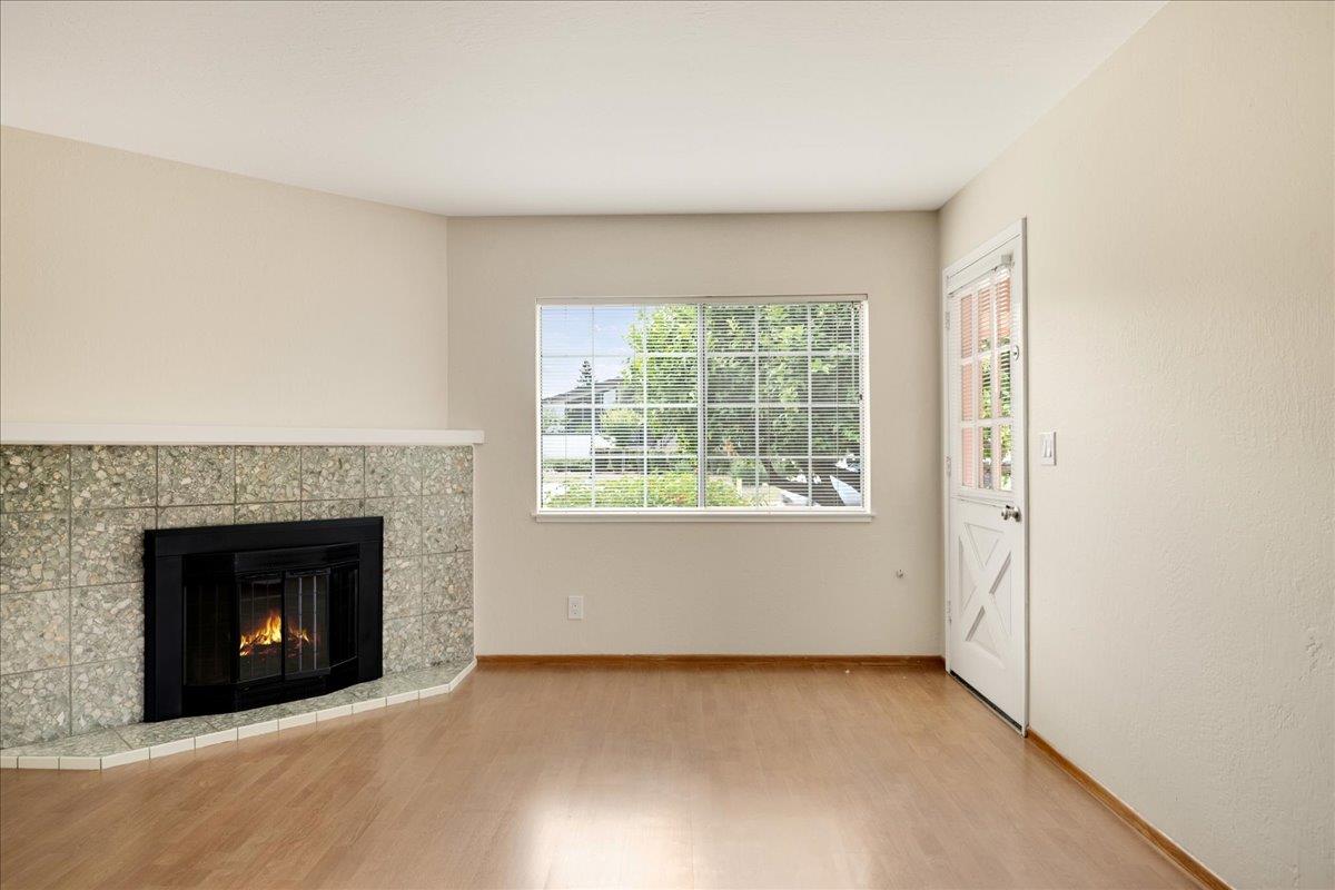 1198 Boranda Avenue Mountain View, CA 94040 - Photo 19 of 38 an empty room with windows and fireplace