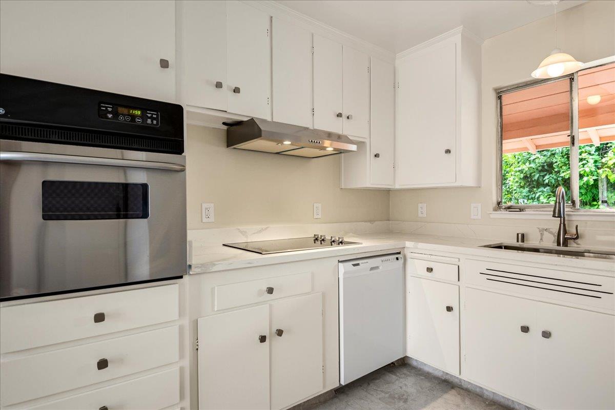 1198 Boranda Avenue Mountain View, CA 94040 - Photo 21 of 38 a kitchen with white cabinets and appliances