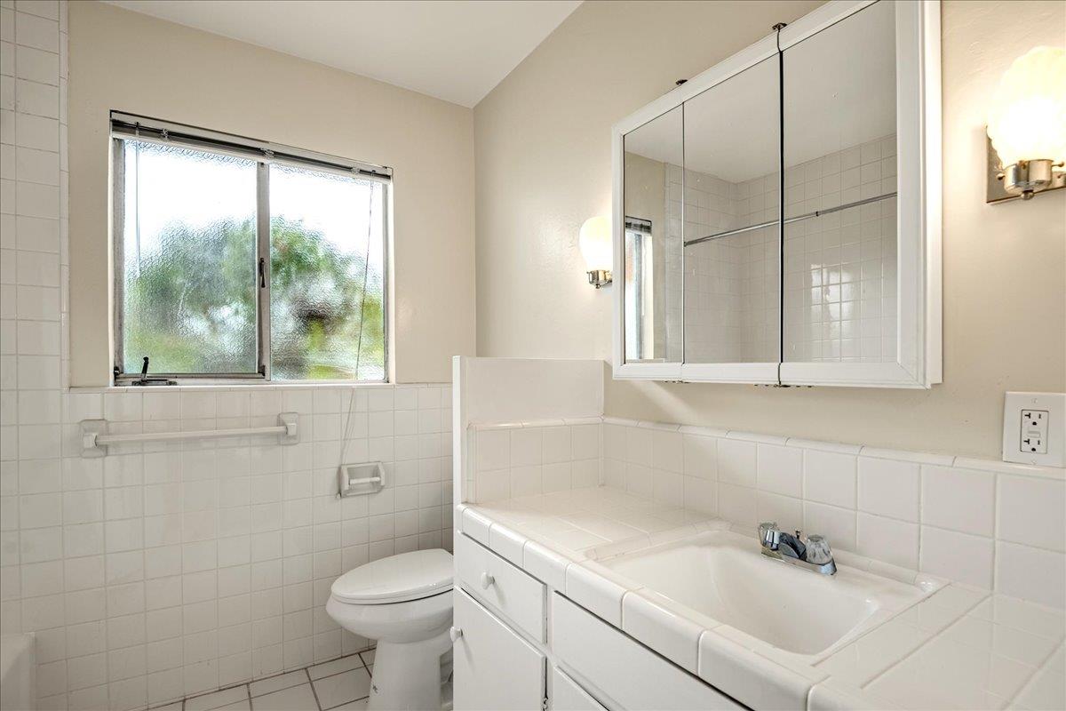 1198 Boranda Avenue Mountain View, CA 94040 - Photo 24 of 38 a bathroom with a sink toilet and shower