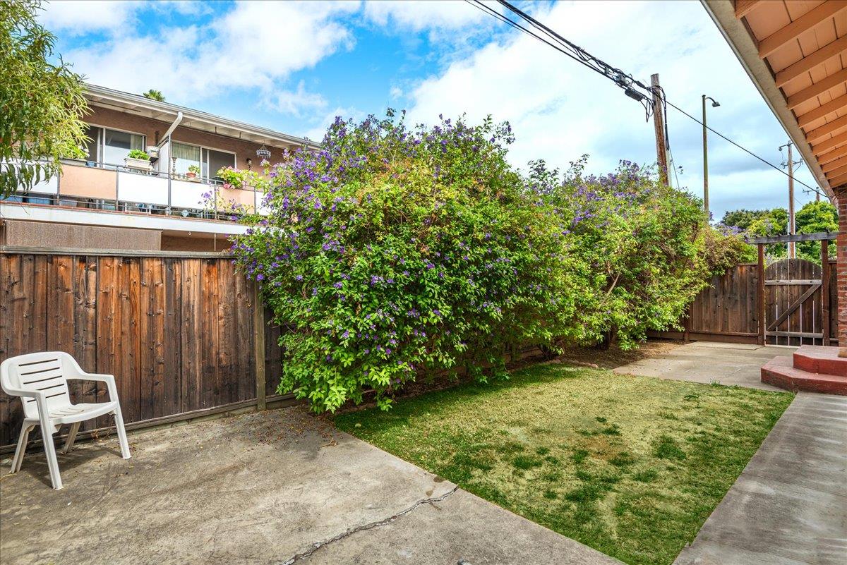 1198 Boranda Avenue Mountain View, CA 94040 - Photo 30 of 38 a view of a chair and table in backyard of the house