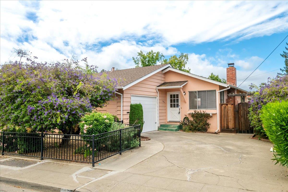 1198 Boranda Avenue Mountain View, CA 94040 - Photo 6 of 38 a front view of a house with a garden