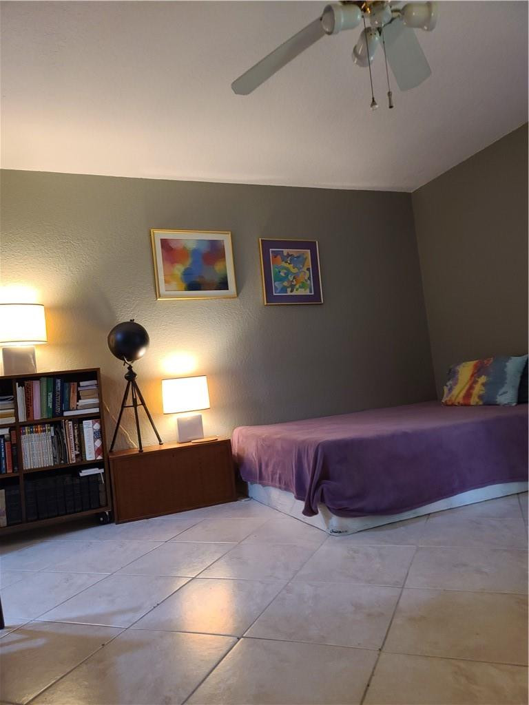 620 Northwest 13th Street, Unit 13 Boca Raton, FL 33486 - Photo 7 of 11 a living room with hard wood flooring and a couch