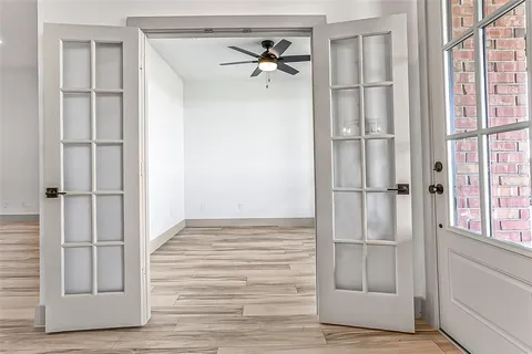 a view of an entryway with wooden floor