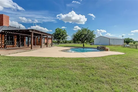 a view of a playground with basketball court