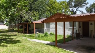 10005 Cypress North Houston Road Houston, TX 77070 - Photo 11 of 31 a front view of a house with a yard