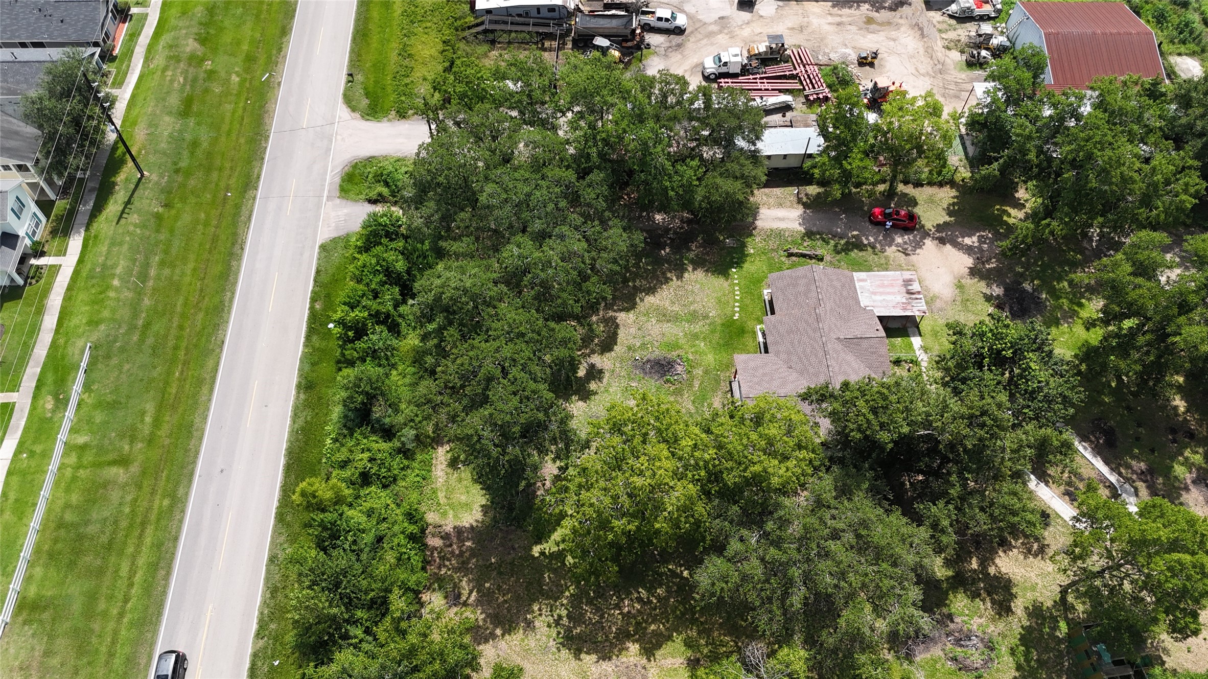 10005 Cypress North Houston Road Houston, TX 77070 - Photo 23 of 31 an aerial view of a house with a yard and trees