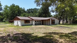 10005 Cypress North Houston Road Houston, TX 77070 - Photo 3 of 31 a front view of a house with garden