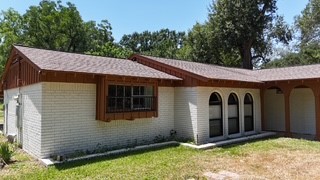 10005 Cypress North Houston Road Houston, TX 77070 - Photo 4 of 31 a view of a house with a yard and wooden fence