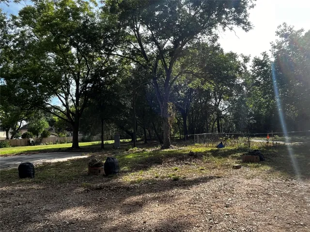 a view of a yard with of trees