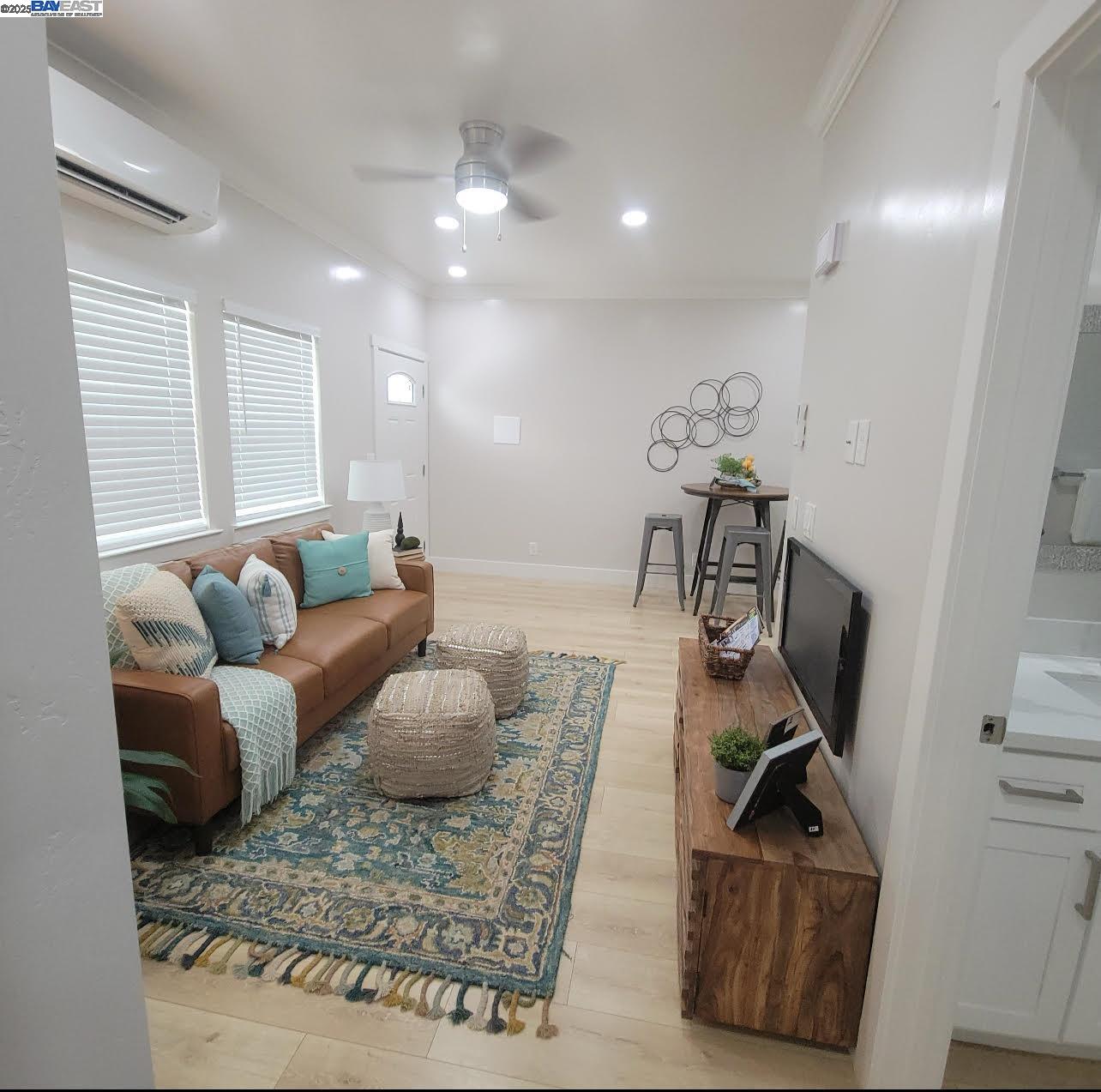 2625 Beaumont Street Sacramento, CA 95815 - Photo 9 of 15 a living room with furniture and a flat screen tv