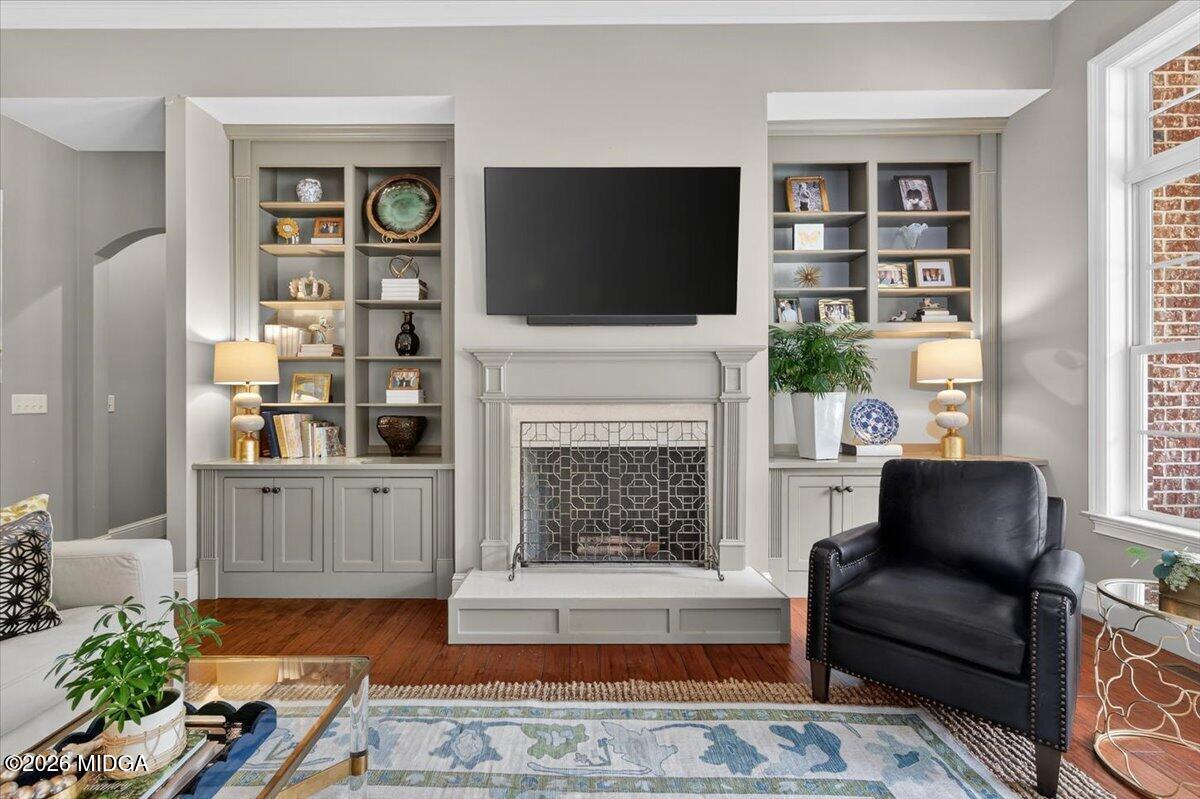106 Lagrange Place Macon, GA 31210 - Photo 20 of 76 a living room with furniture a flat screen tv and a fireplace
