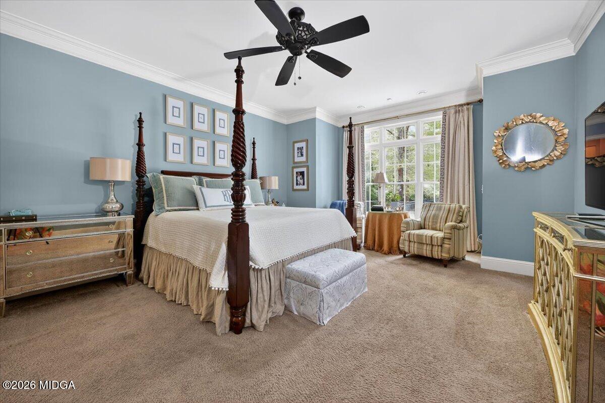 106 Lagrange Place Macon, GA 31210 - Photo 22 of 76 a spacious bedroom with a bed and a chandelier